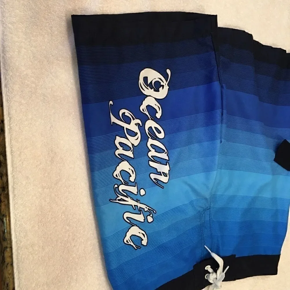 Ocean Pacific Medium swim shorts blue black trunks good condition tie at waist